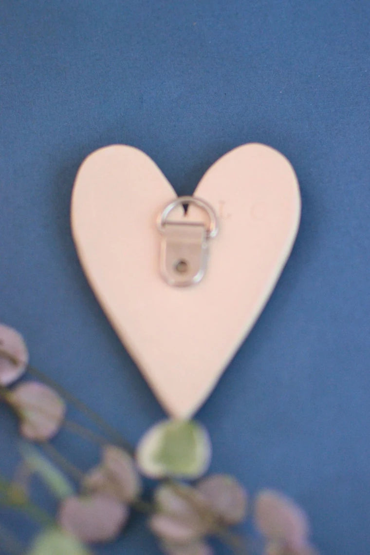 Ceramics heart glazed in blues and turquoise designed to hang on the wall