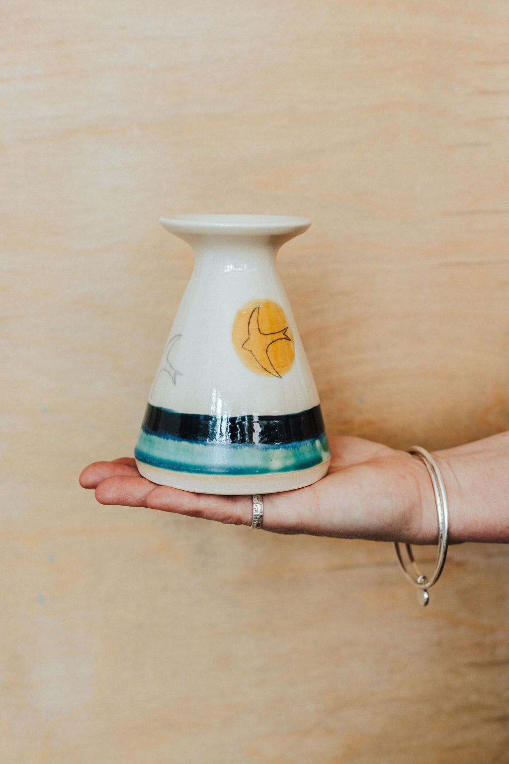 Handmade ceramic flared bud vase - decorated with a golden sun and Swift