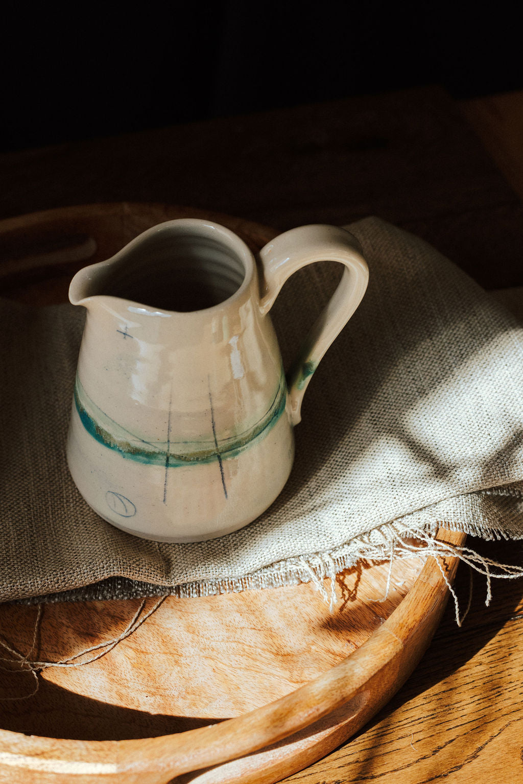 Handmade ceramic small jug - decorated in pale sea coloured glazes