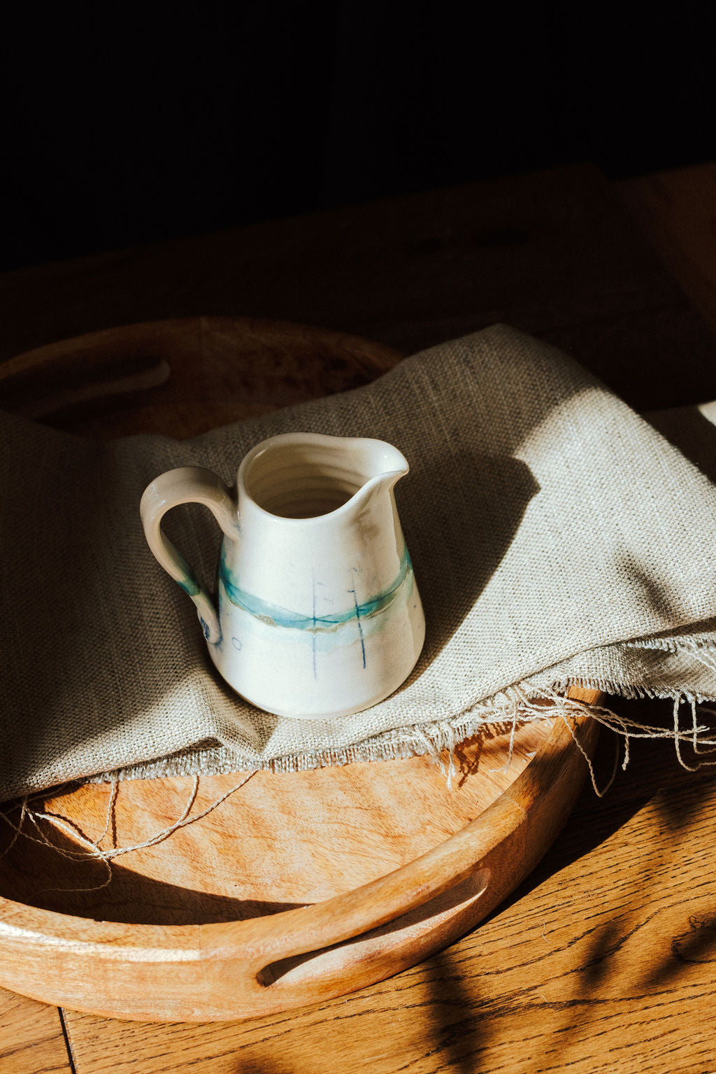 Handmade ceramic small jug - decorated in pale sea coloured glazes