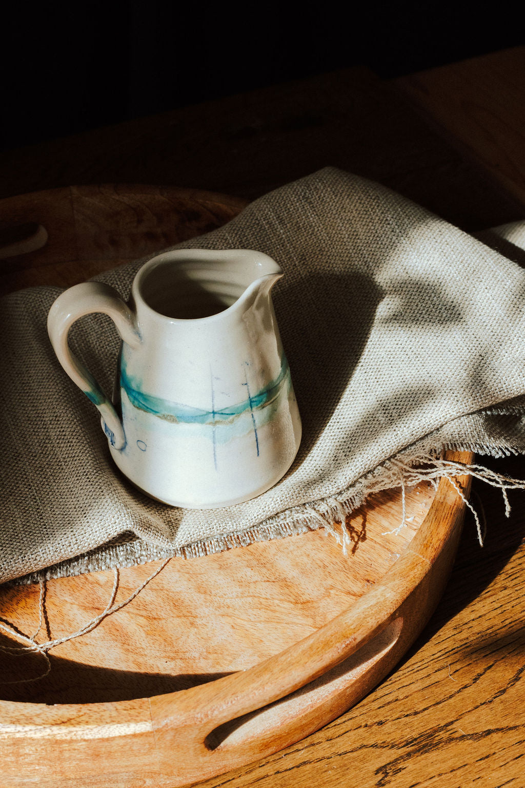 Handmade ceramic small jug - decorated in pale sea coloured glazes