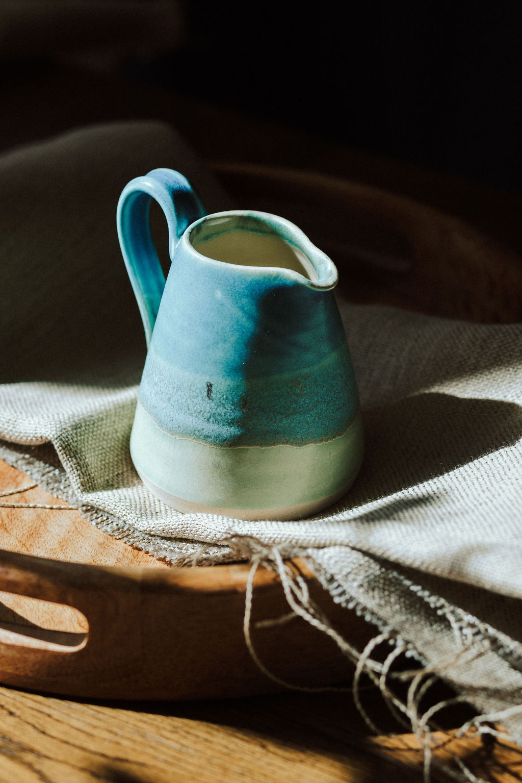 Handmade ceramic small jug - decorated in blues and turquoise glazes
