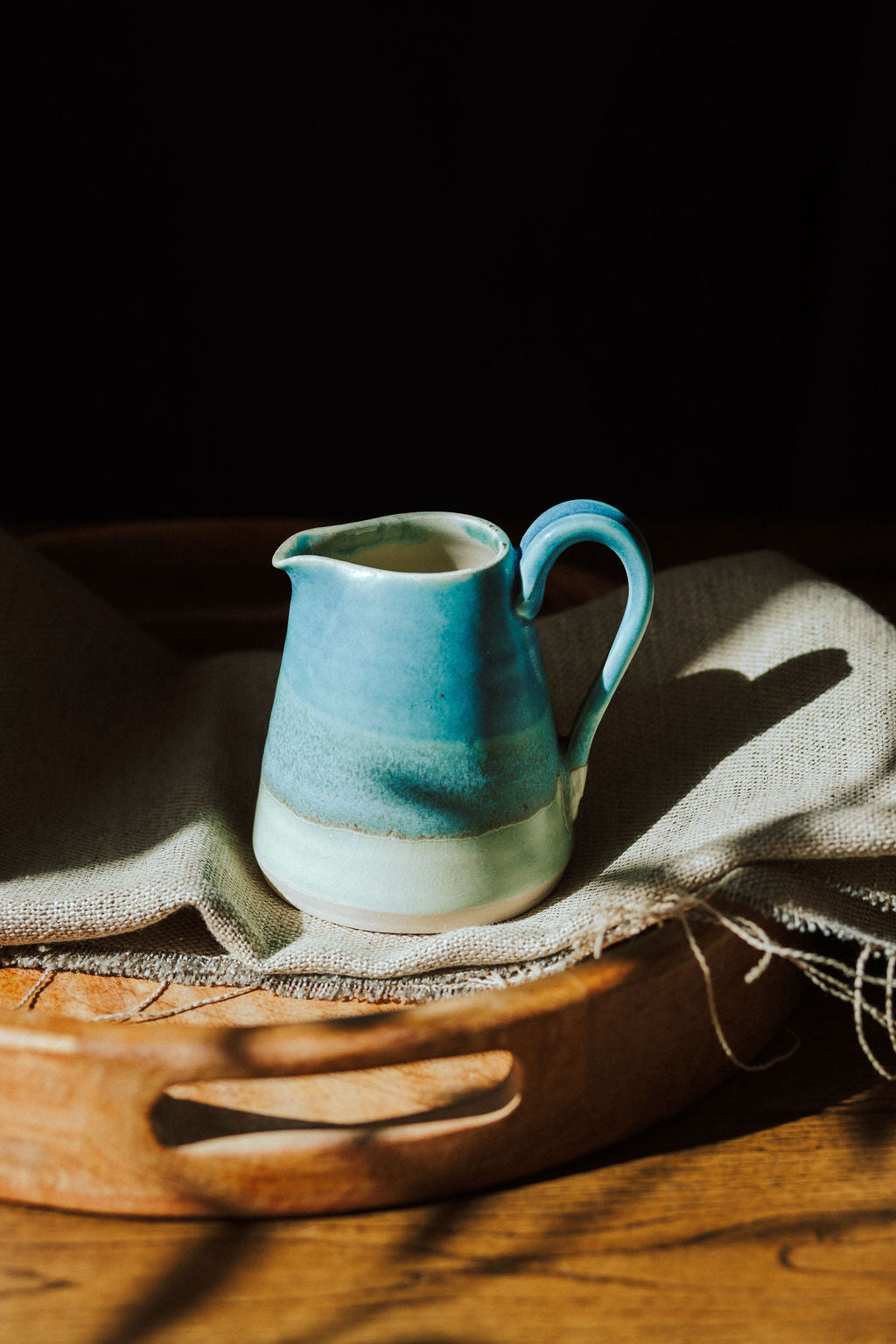 Handmade ceramic small jug - decorated in blues and turquoise glazes