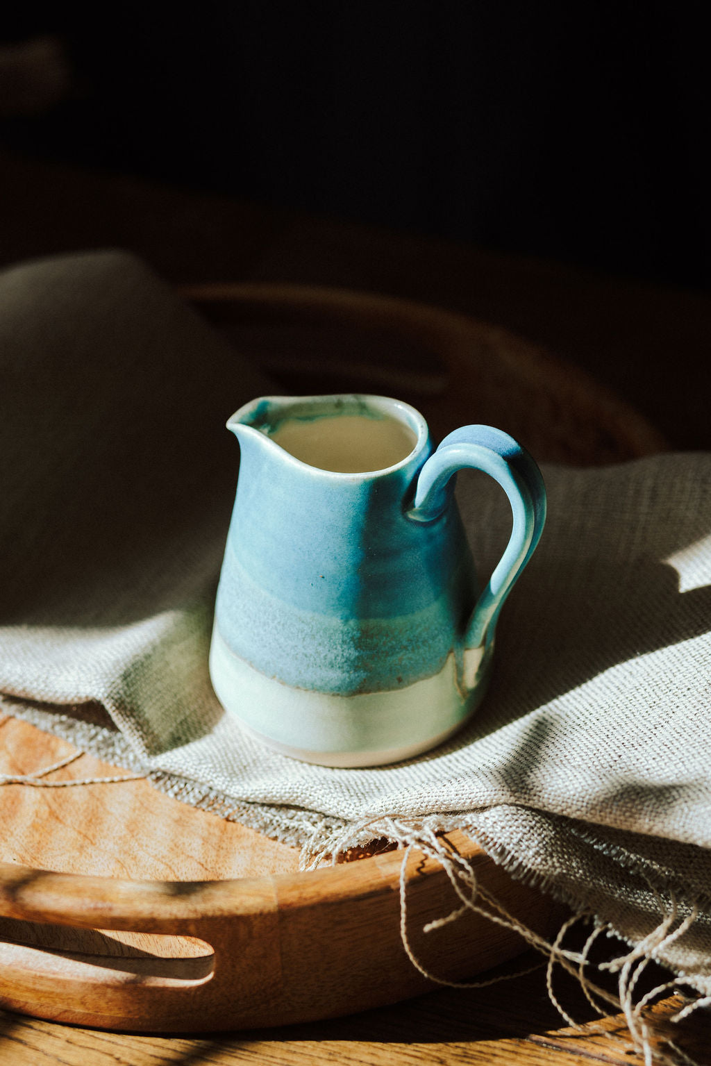 Handmade ceramic small jug - decorated in blues and turquoise glazes