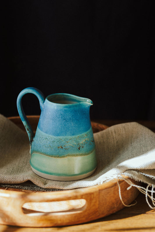 Handmade ceramic small jug - decorated in blues and turquoise glazes
