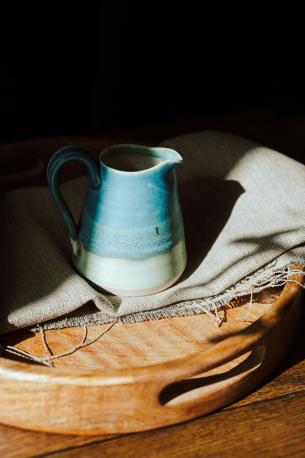 Handmade ceramic small jug - decorated in blues and turquoise glazes