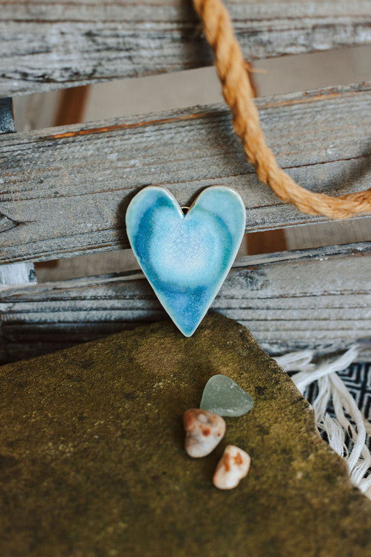 Ceramics heart glazed in blues and turquoise designed to hang on the wall