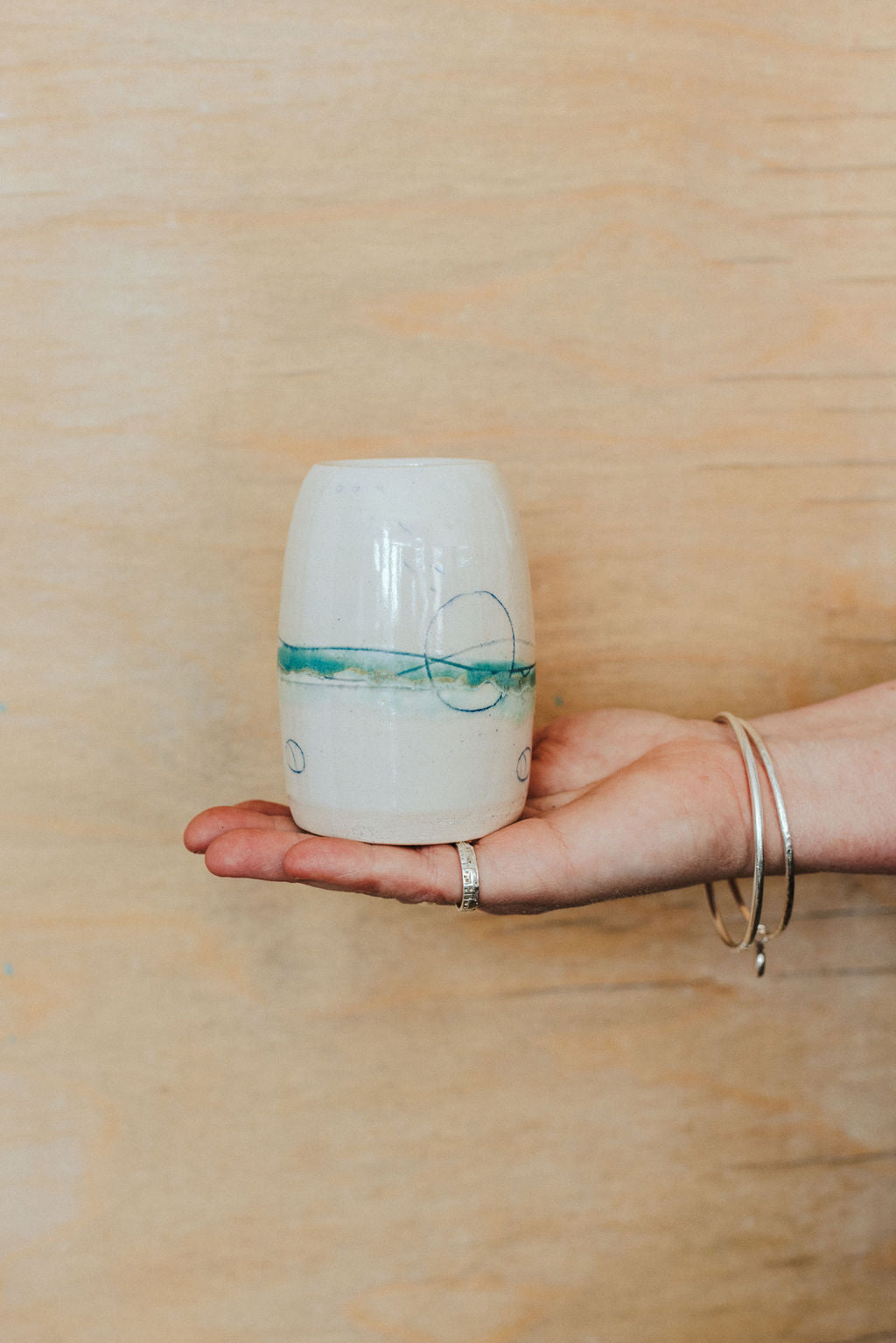 Handmade ceramic posy vase - decorated with sea inspired colours greens and blues