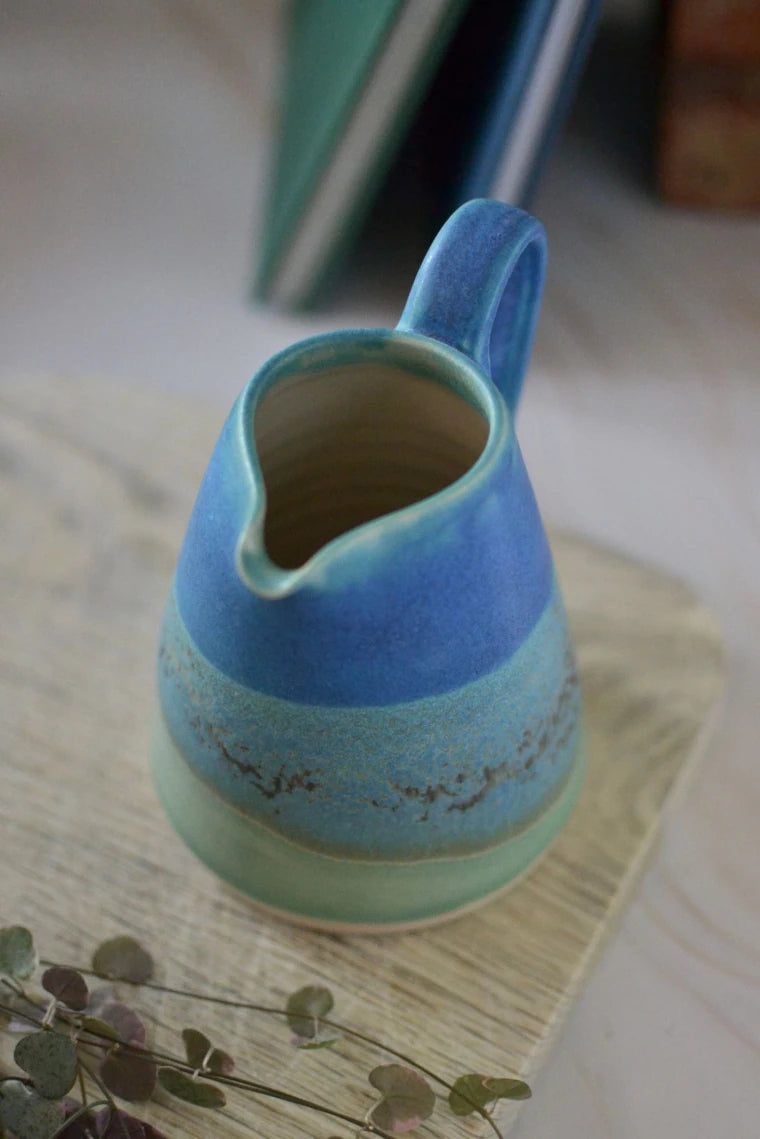 Handmade ceramic small jug - decorated in blues and turquoise glazes