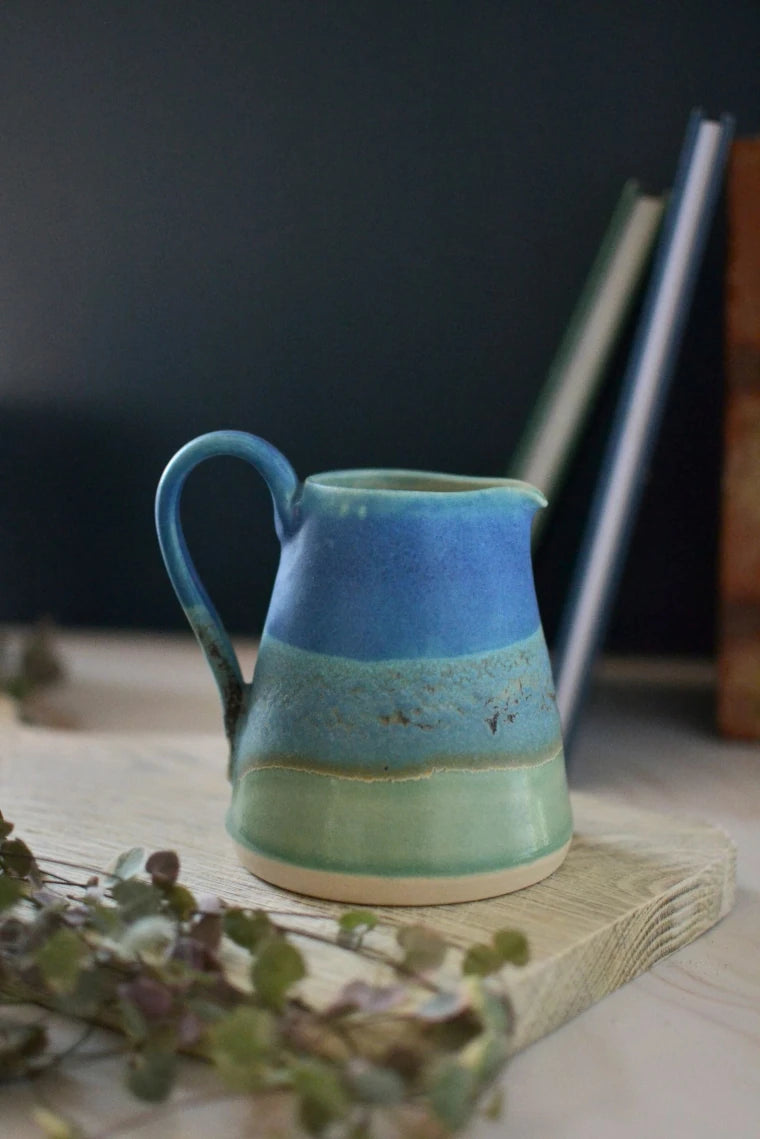 Handmade ceramic small jug - decorated in blues and turquoise glazes