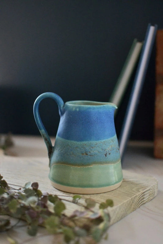 Handmade ceramic small jug - decorated in blues and turquoise glazes