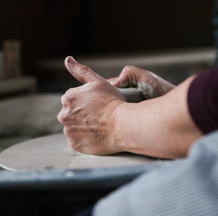 Lorna Gilbert Ceramics working at the pottery wheel