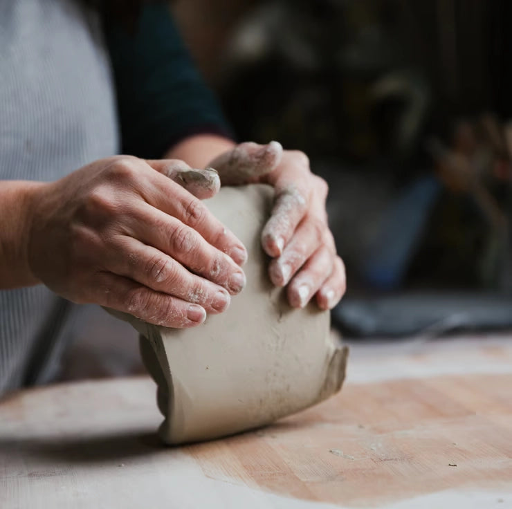 Lorna Gilbert Ceramics working a slab of clay