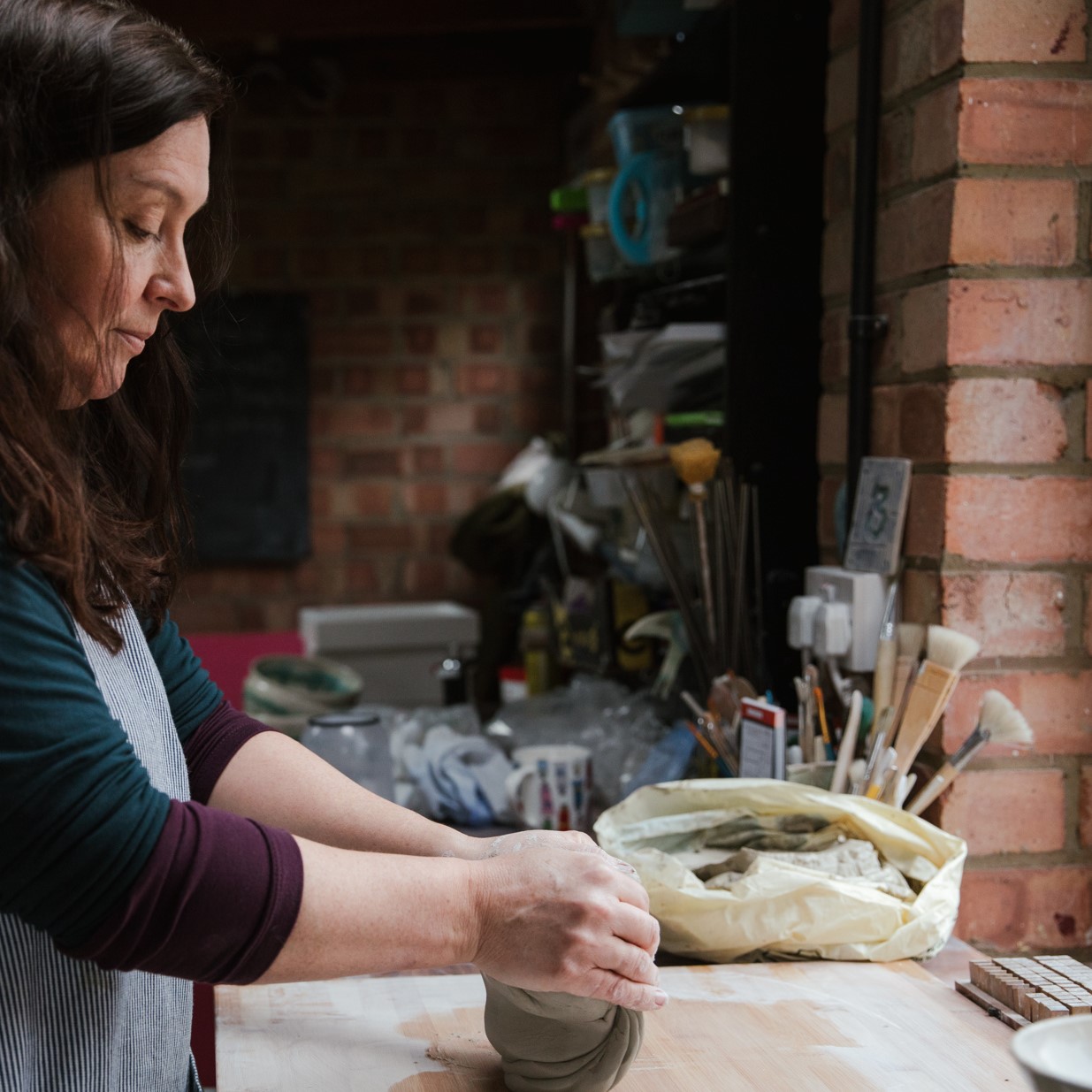 Lorna Gilbert Ceramics working in her pottery studio in Yorkshire, UK