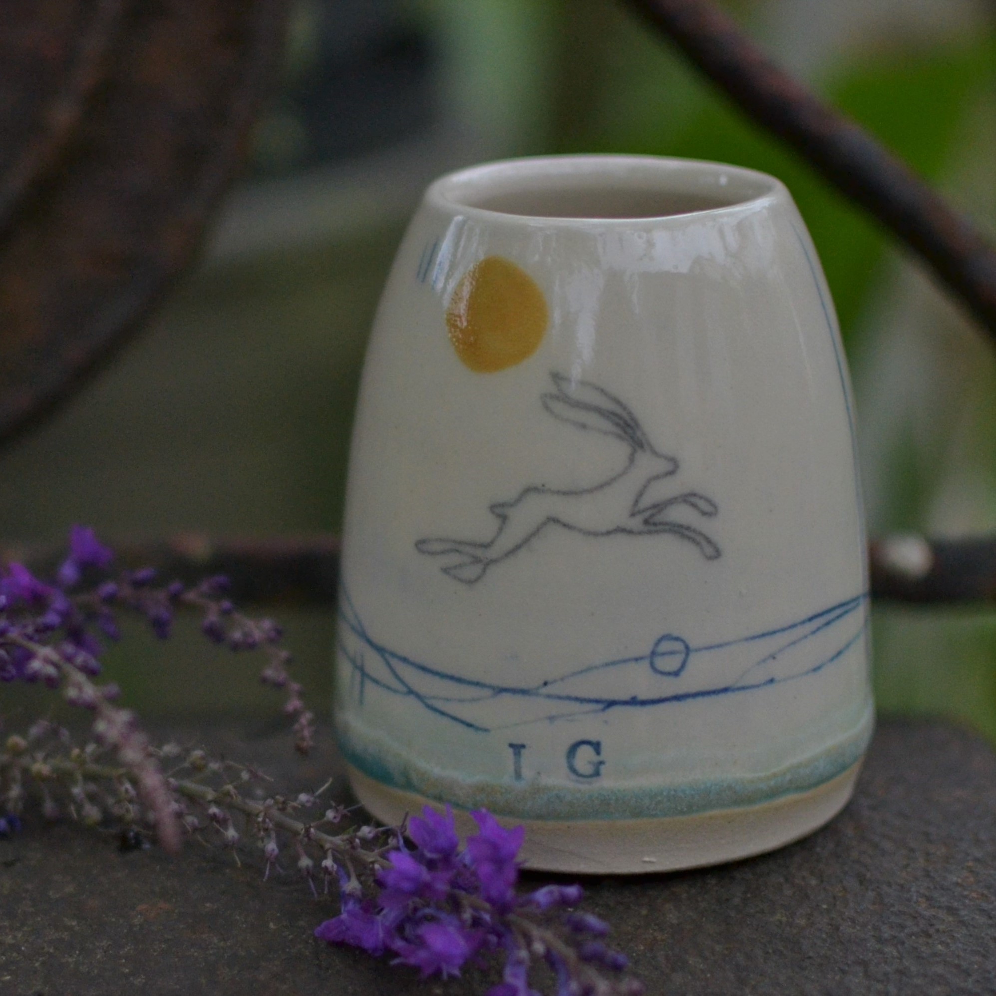 A handmade ceramic posy vase thrown on the potter wheel